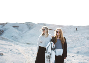 Two girls wearing NOZ Reef Safe Zinc Sunscreen on the beach.